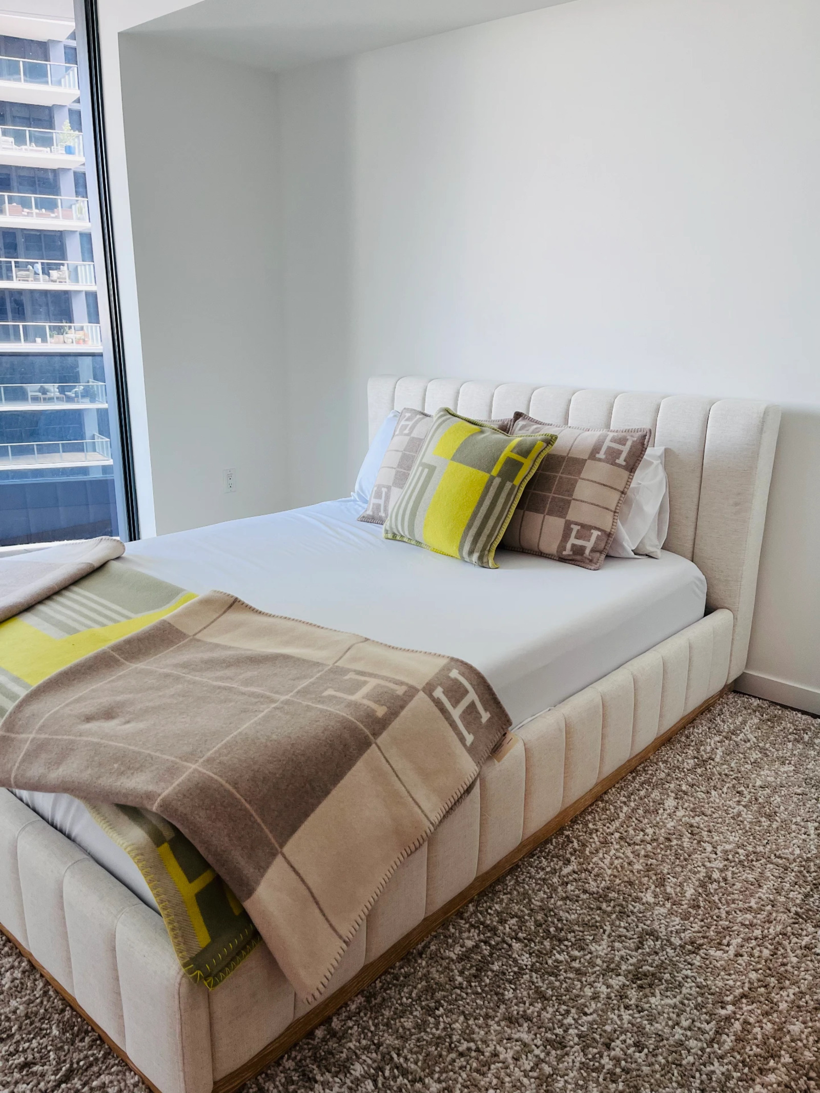 Freshly made bed and detailed bedroom after a residential turnover cleaning